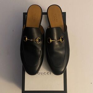 Gucci Black Leather Mules with Gold Detailing